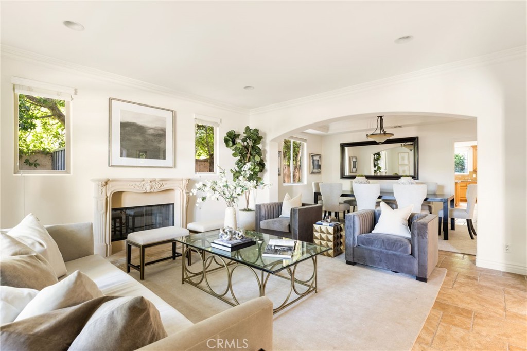 16659 Addison Street Encino, CA 91436 - Photo 8 of 48 a living room with furniture and a fireplace