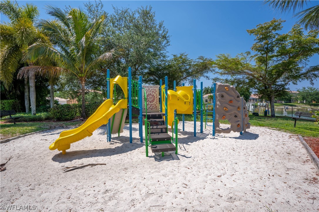 11731 Eros Road Lehigh Acres, FL 33971 - Photo 28 of 33 a view of a park with slide