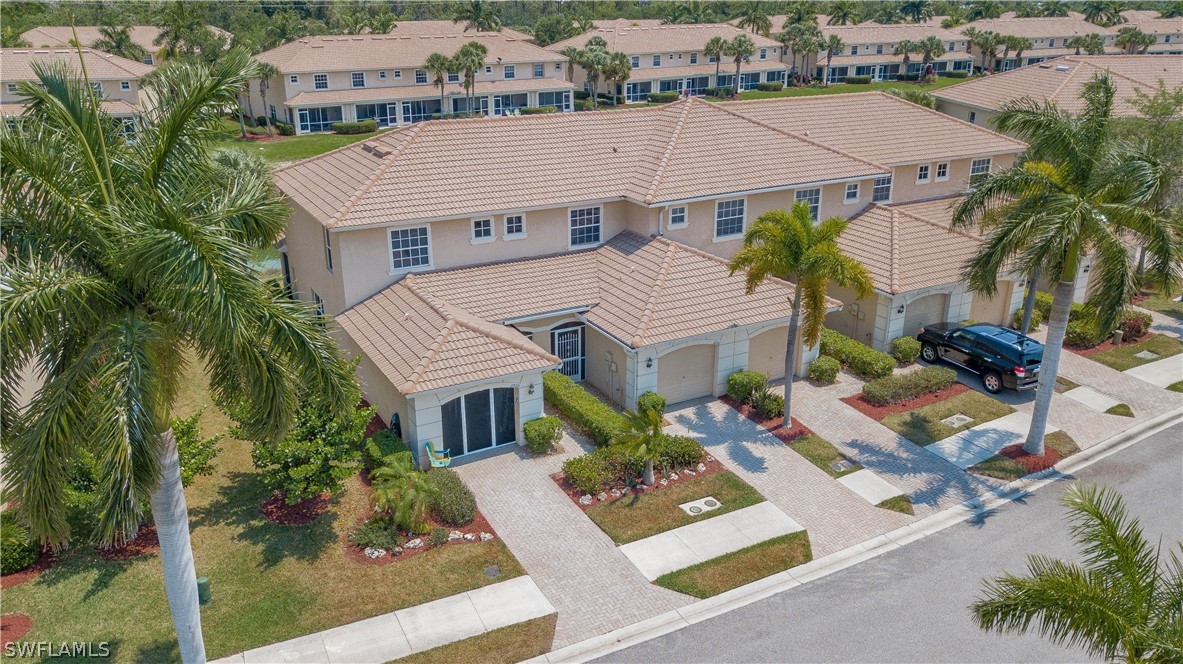 11731 Eros Road Lehigh Acres, FL 33971 - Photo 3 of 33 an aerial view of a house with garden space and street view