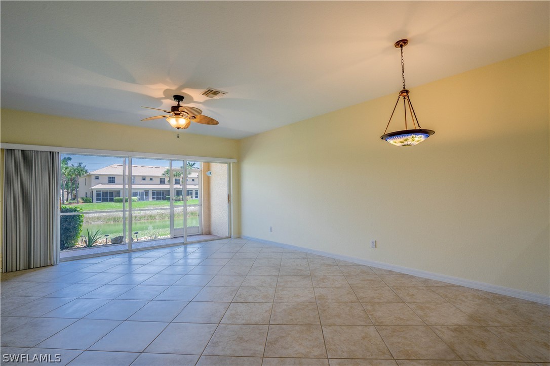 11731 Eros Road Lehigh Acres, FL 33971 - Photo 8 of 33 a view of a room with window and ceiling fan