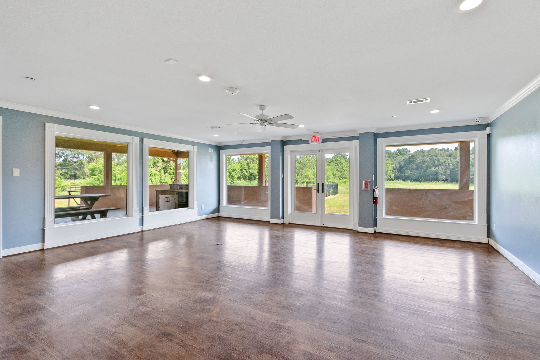 17018 Grant Road Cypress, TX 77429 - Photo 11 of 50 a view of an empty room with wooden floor and a window