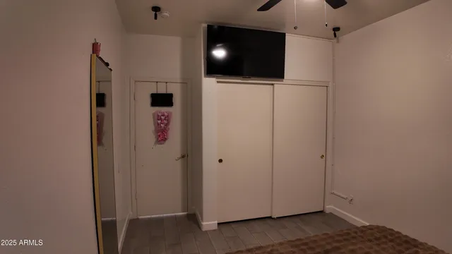 a bathroom with a sink toilet and mirror