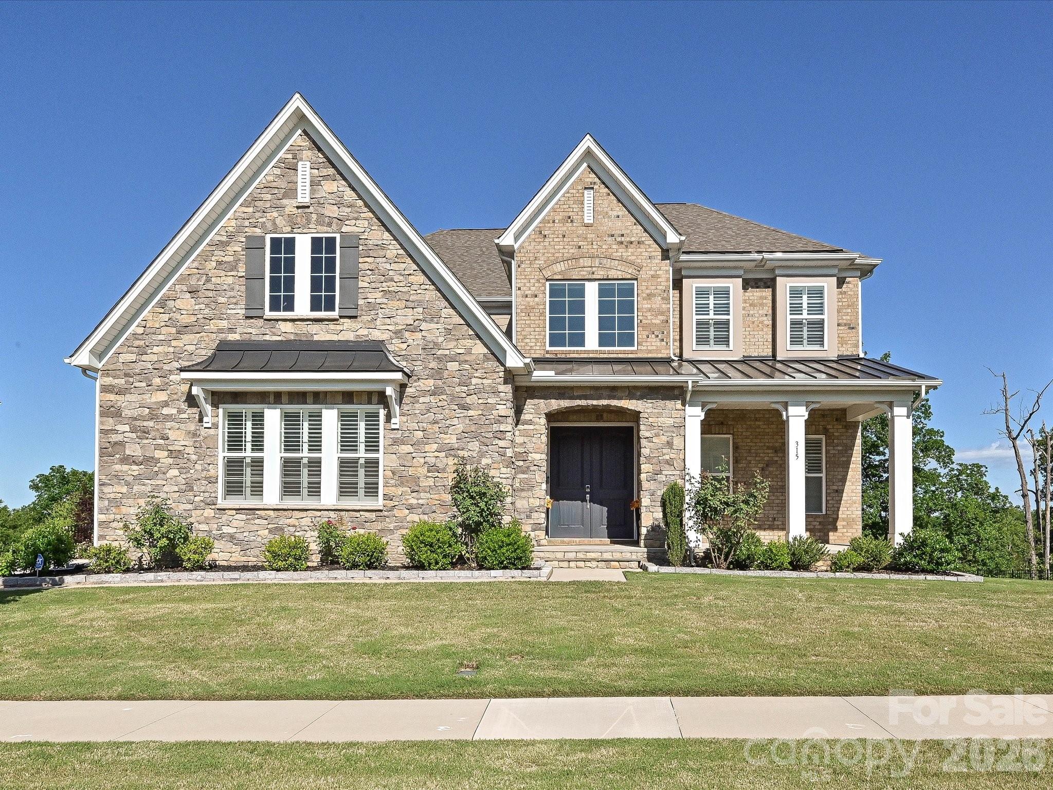 315 West Waterlynn Road Mooresville, NC 28117 - Photo 1 of 46 a front view of a house with a yard