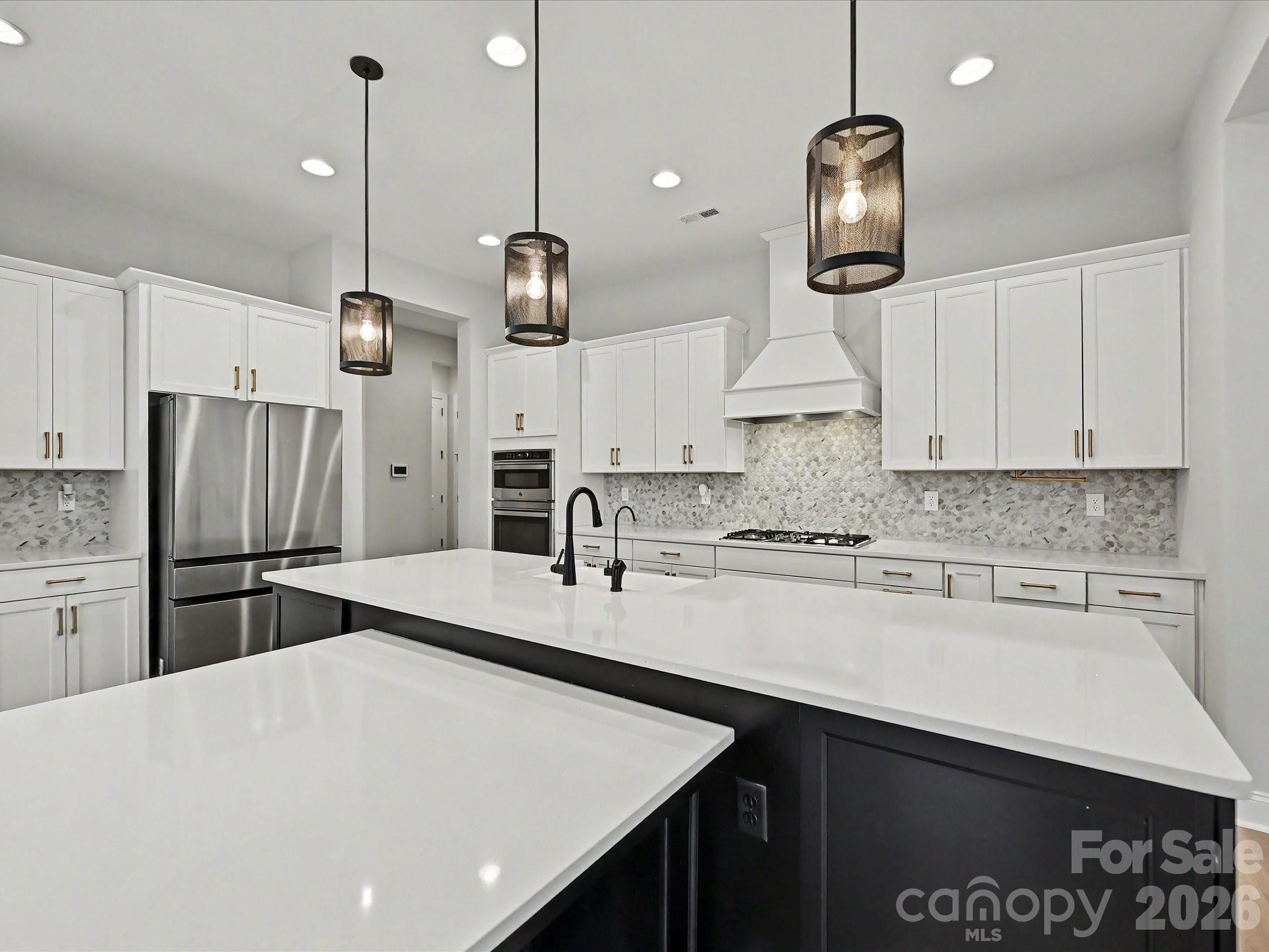 315 West Waterlynn Road Mooresville, NC 28117 - Photo 13 of 46 a kitchen with refrigerator cabinets and stove
