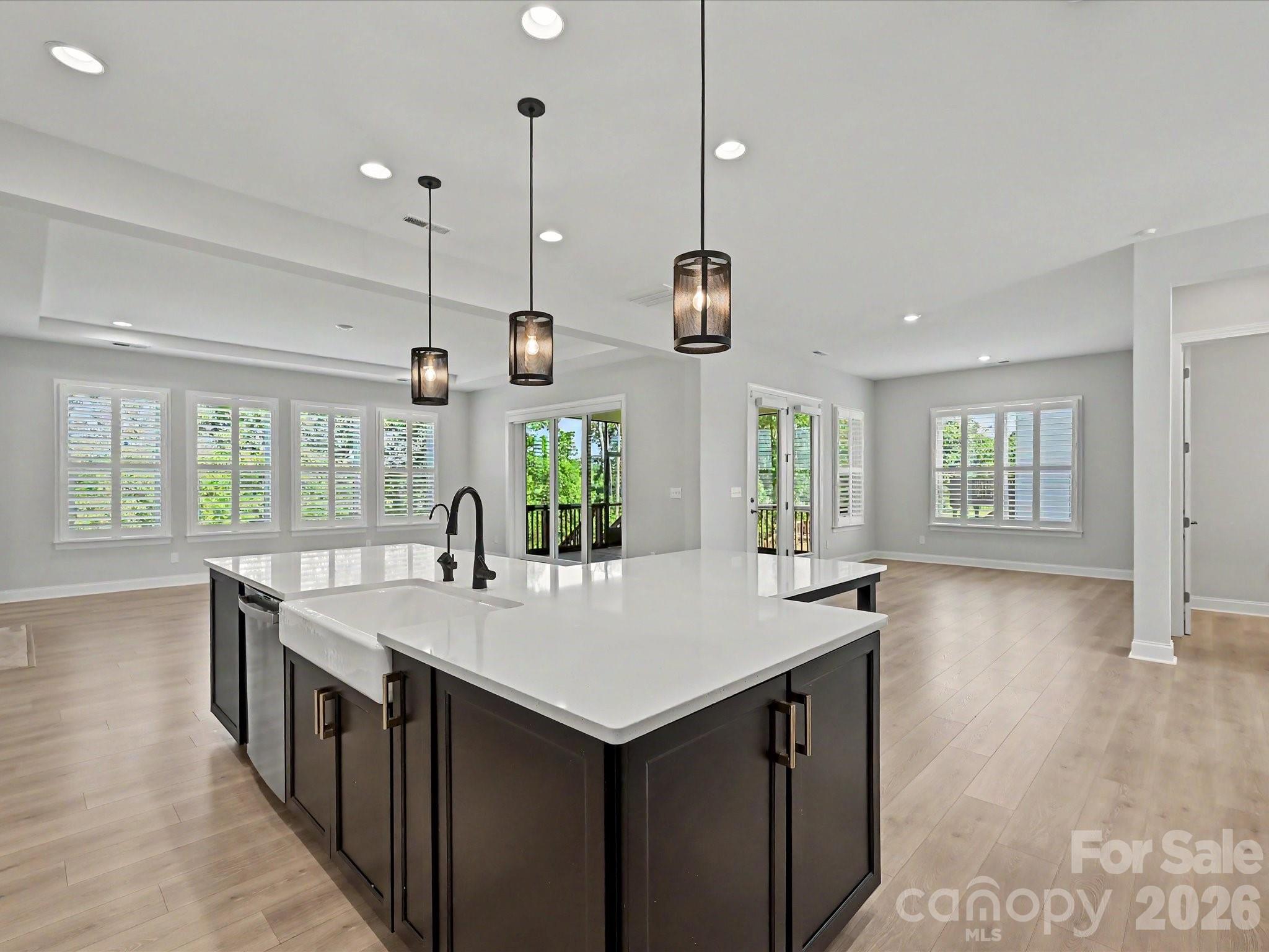 315 West Waterlynn Road Mooresville, NC 28117 - Photo 16 of 46 a large kitchen with kitchen island a large island in it