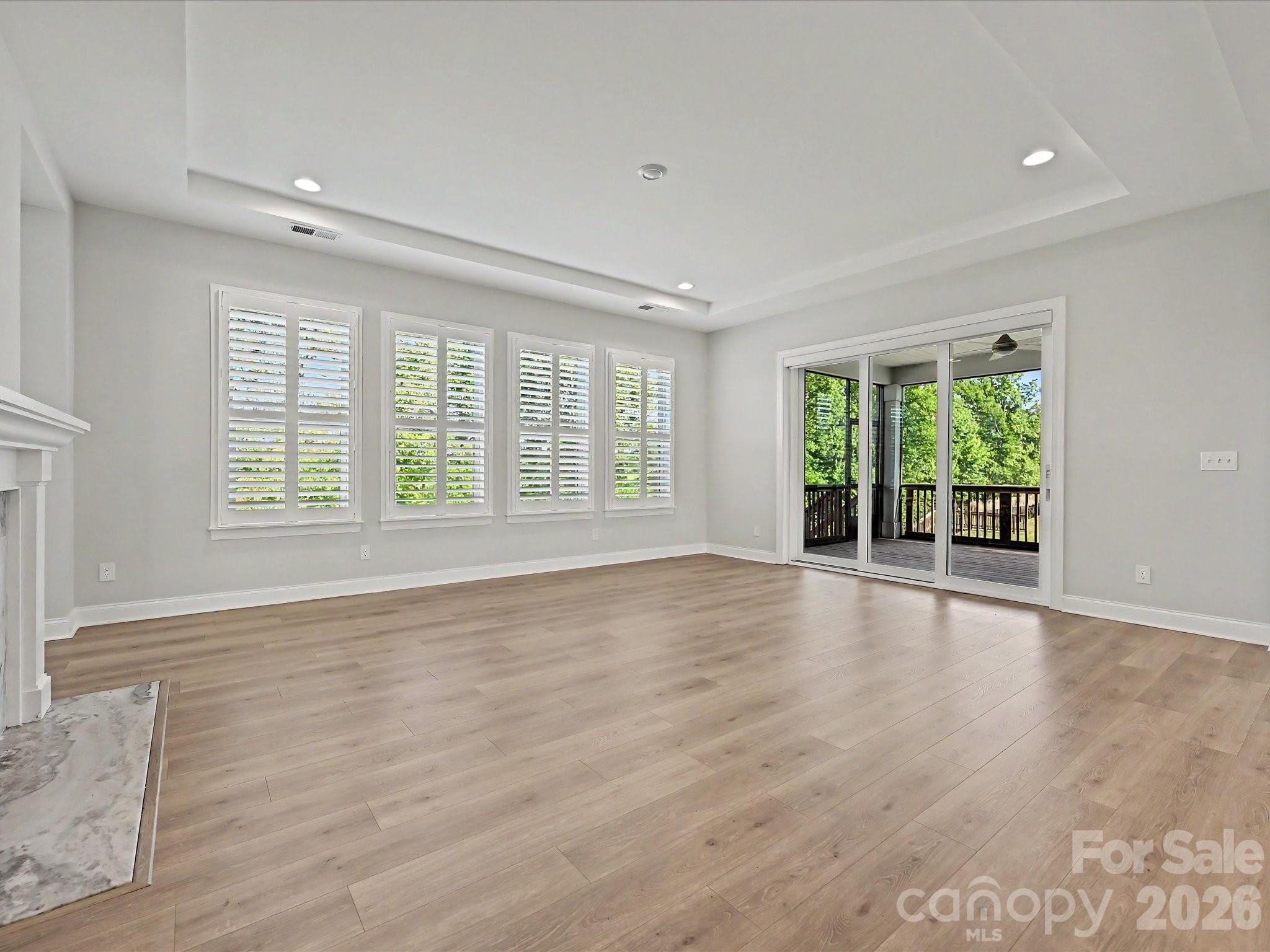 315 West Waterlynn Road Mooresville, NC 28117 - Photo 17 of 46 a view of an empty room with wooden floor and a window