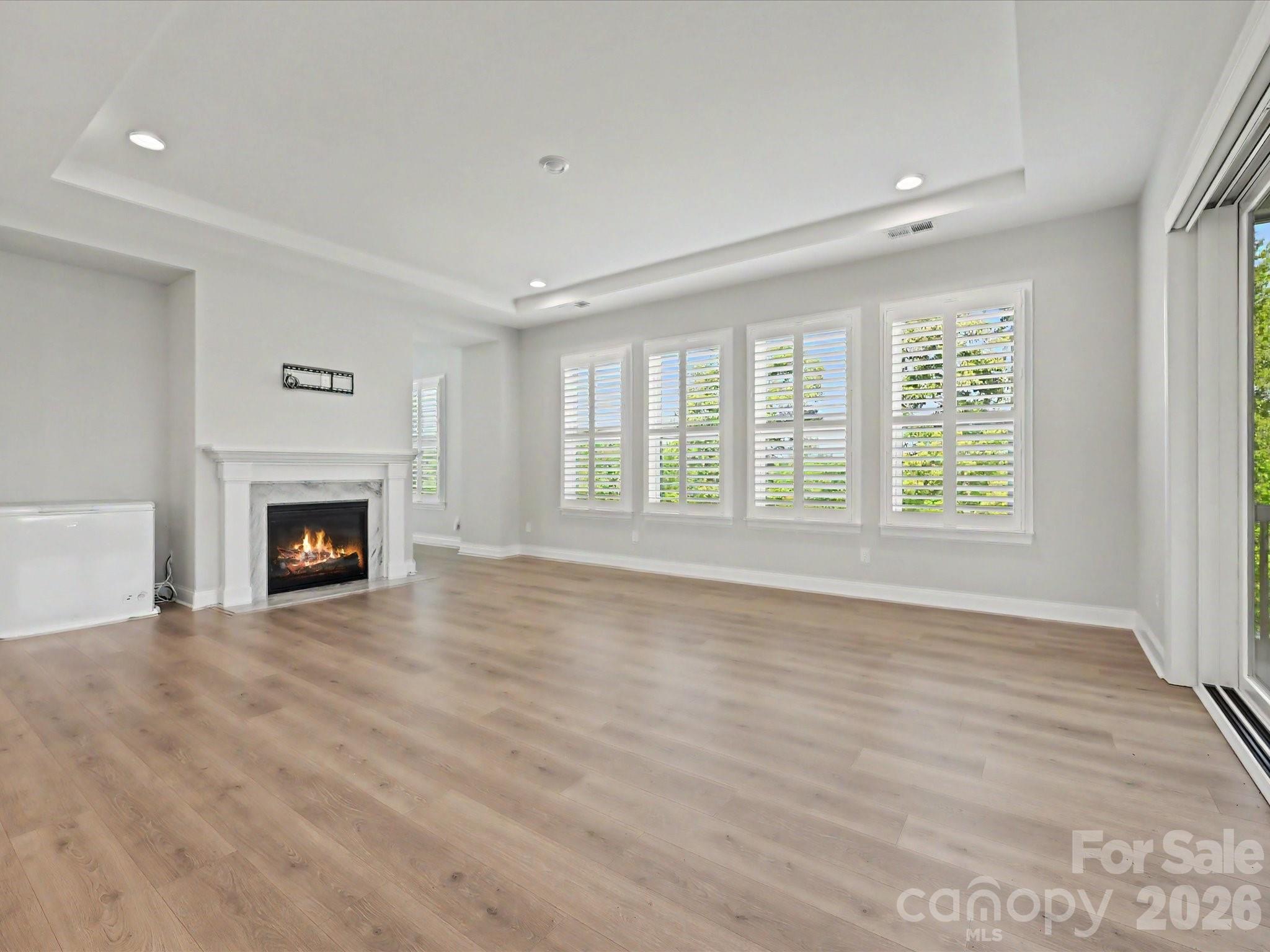315 West Waterlynn Road Mooresville, NC 28117 - Photo 18 of 46 a view of an empty room with a window and fireplace