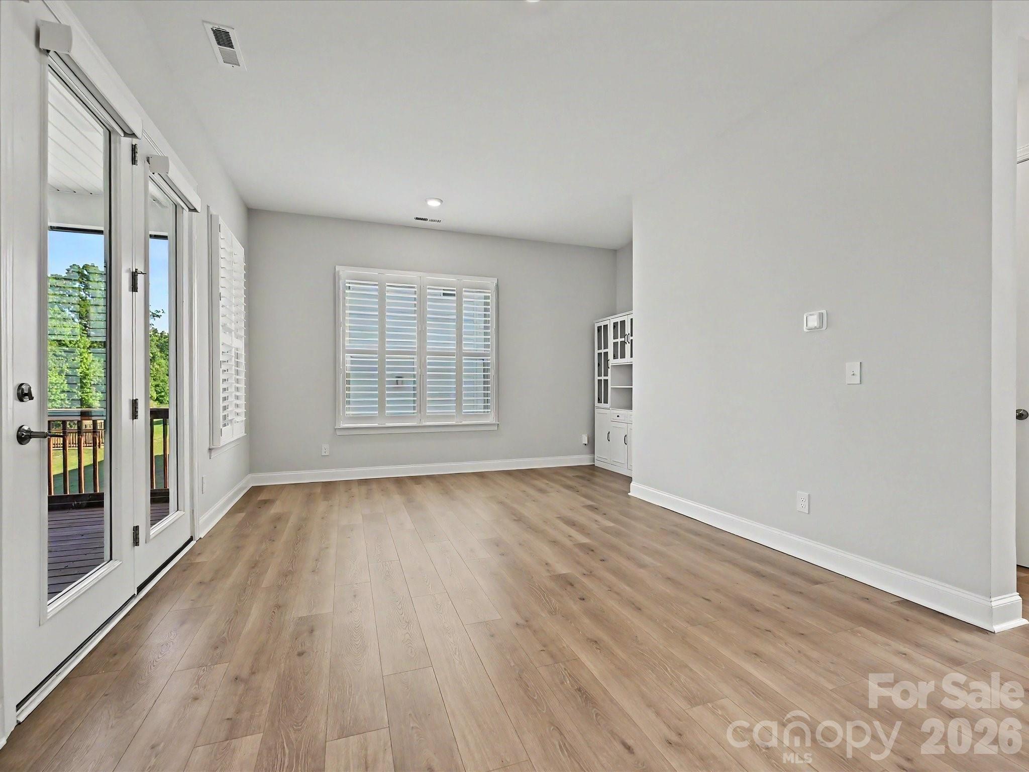315 West Waterlynn Road Mooresville, NC 28117 - Photo 23 of 46 wooden floor in an empty room with a window