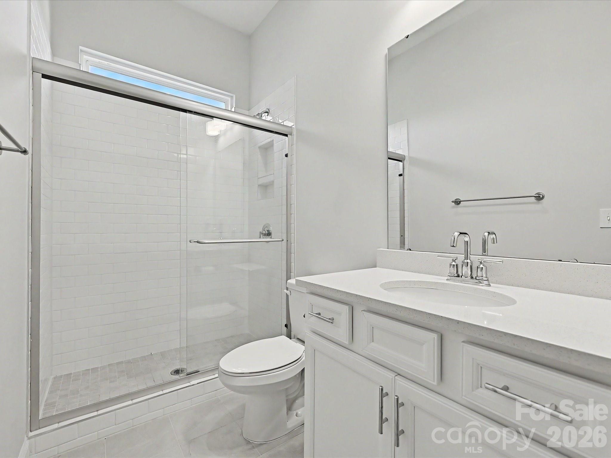315 West Waterlynn Road Mooresville, NC 28117 - Photo 25 of 46 a bathroom with a sink a toilet and shower
