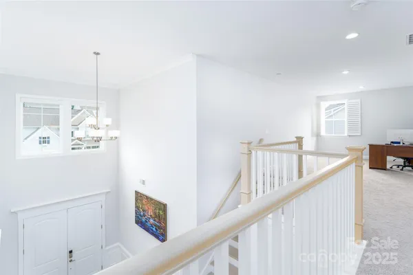 a view of a hallway with windows