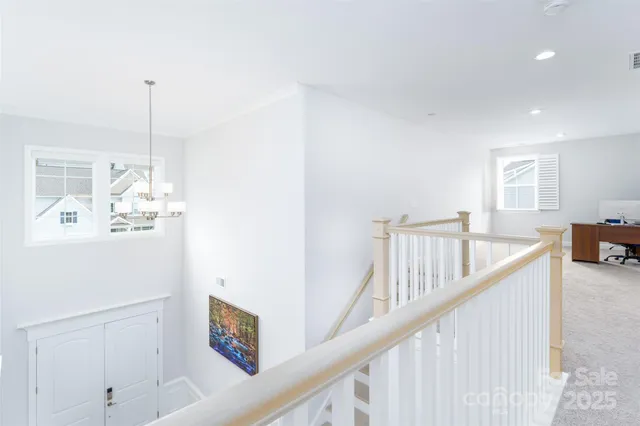 a view of a hallway with windows