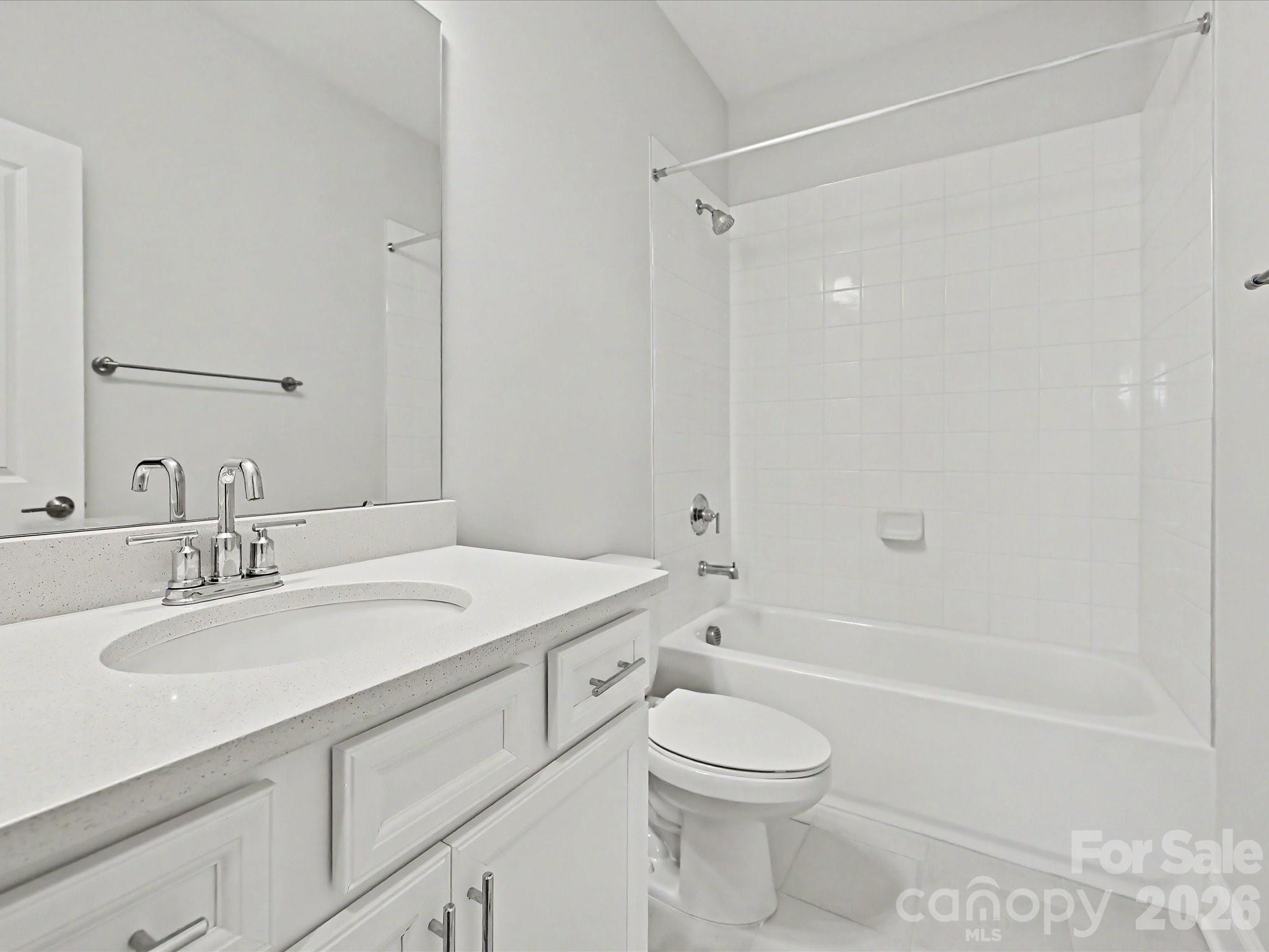 315 West Waterlynn Road Mooresville, NC 28117 - Photo 34 of 46 a bathroom with a granite countertop sink a toilet and shower