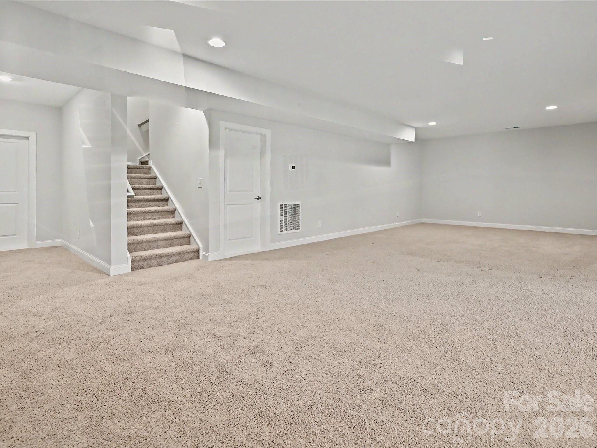 315 West Waterlynn Road Mooresville, NC 28117 - Photo 39 of 46 a view of an empty room with stairs and ventilation
