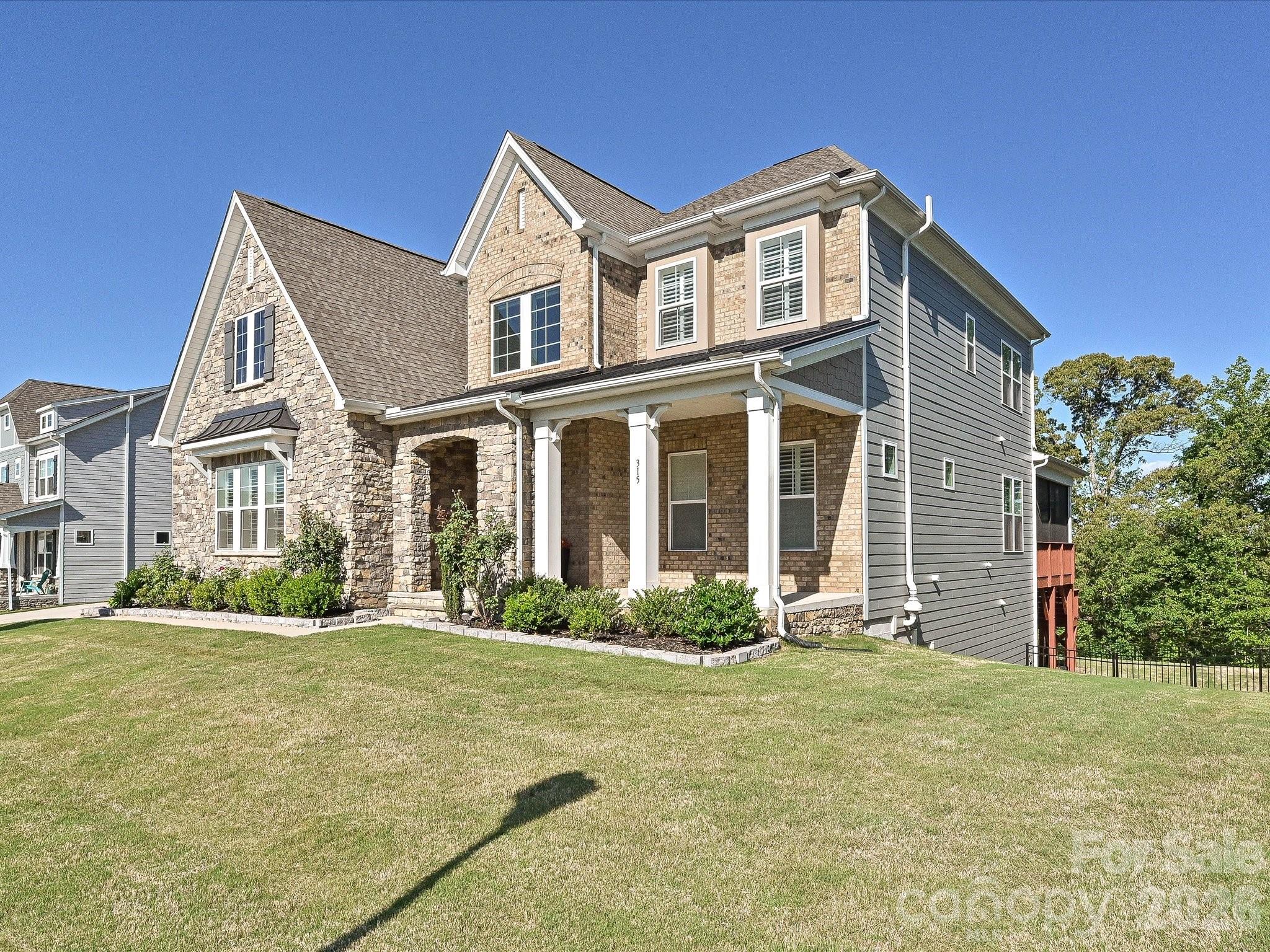 315 West Waterlynn Road Mooresville, NC 28117 - Photo 7 of 46 a front view of a house with a yard