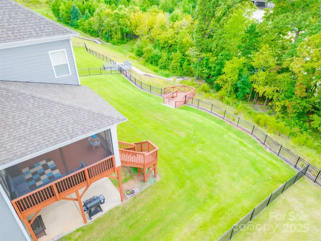 a view of a backyard with chairs