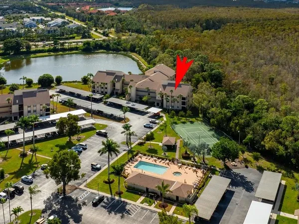 an aerial view of residential houses with outdoor space and river