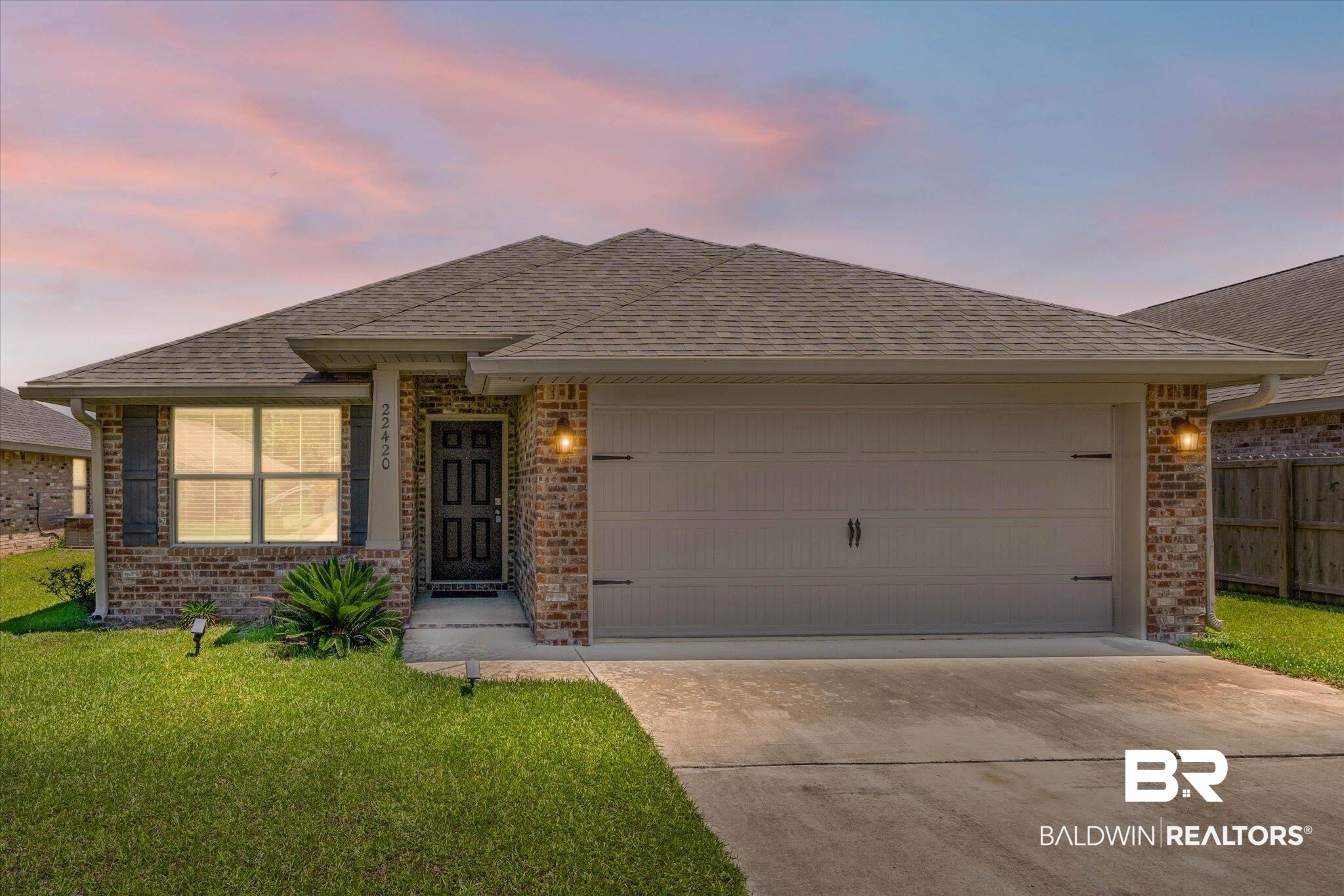 22420 Respite Lane Foley, AL 36535 - Photo 1 of 35 Brick exterior featuring a gabled roof and attached garage