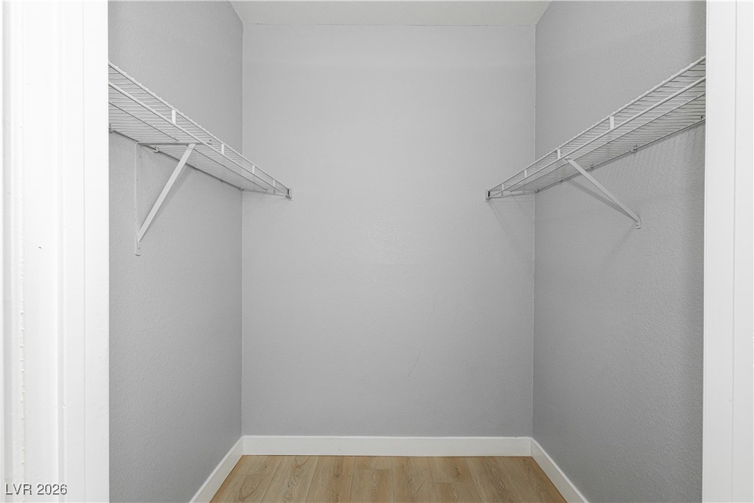 3318 North Decatur Boulevard, Unit 1082 Las Vegas, NV 89130 - Photo 23 of 25 Walk in closet with light wood-style flooring