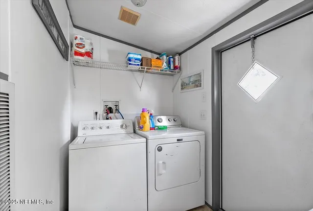 a utility room with dryer and washer