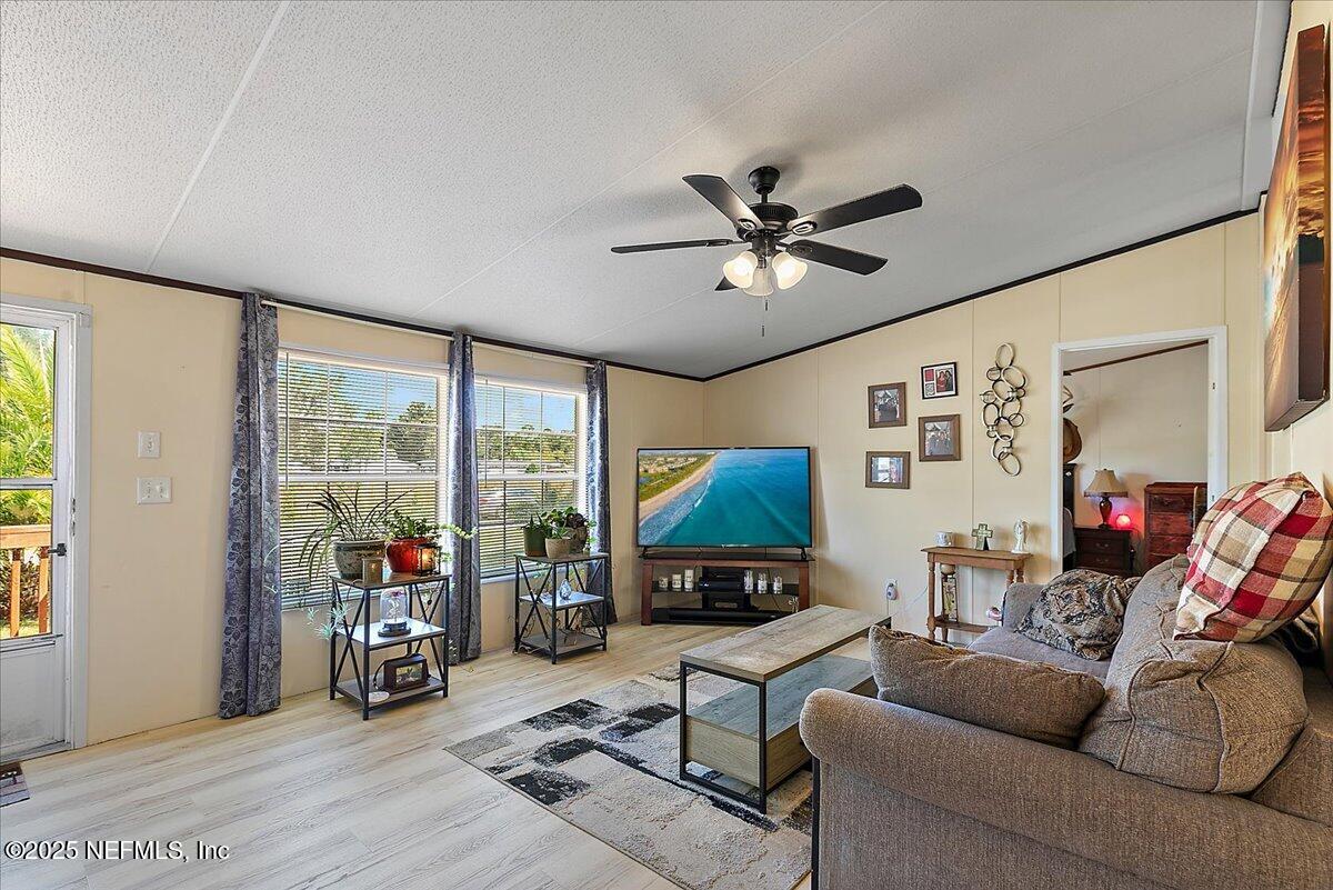 107 Indiana Street Crescent City, FL 32112 - Photo 4 of 19 a living room with furniture and a large window