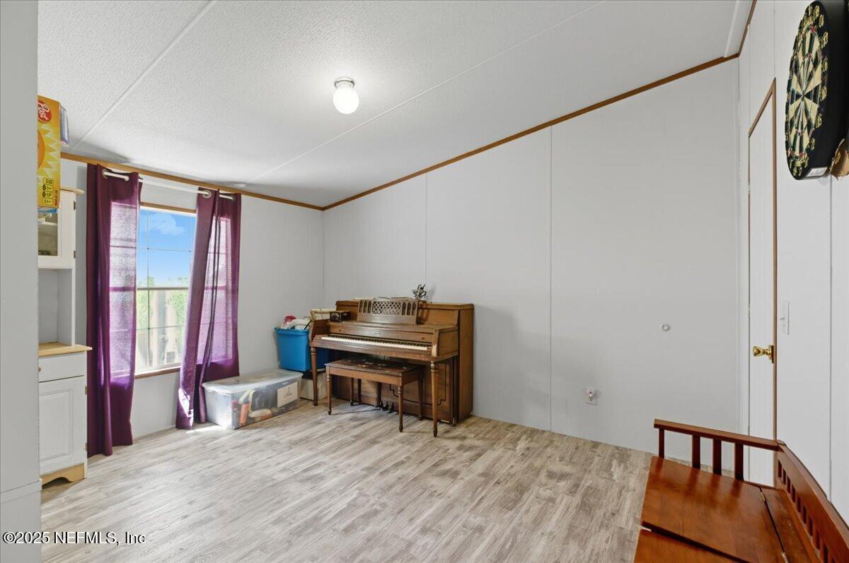 107 Indiana Street Crescent City, FL 32112 - Photo 10 of 19 a bedroom with furniture and a window