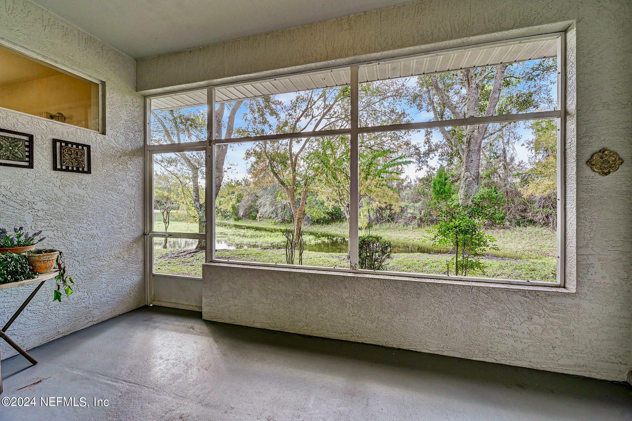 1308 Asher Court Ormond Beach, FL 32174 - Photo 22 of 40 a view of an empty room with a window