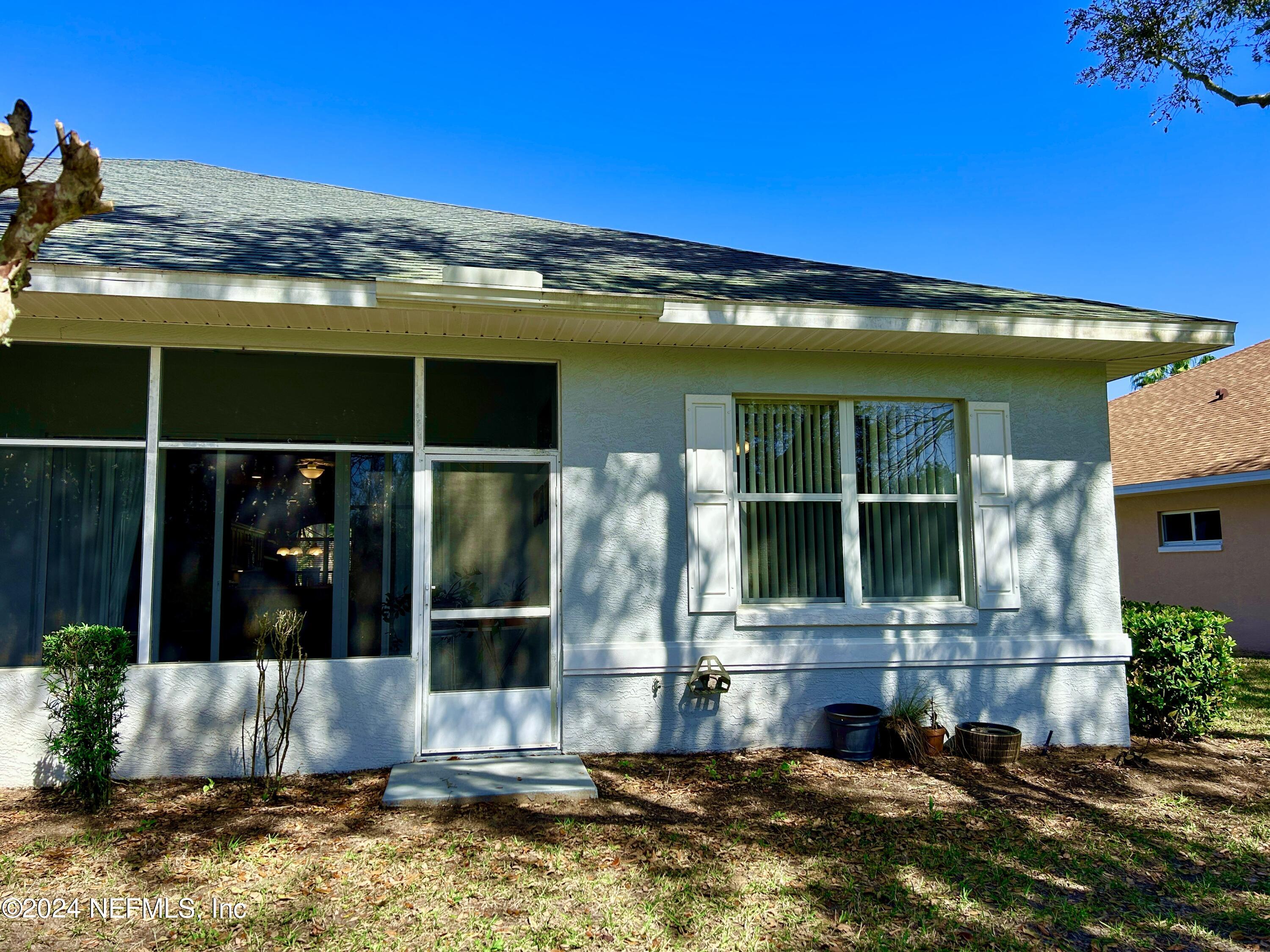 1308 Asher Court Ormond Beach, FL 32174 - Photo 24 of 40 a view of a house with a yard