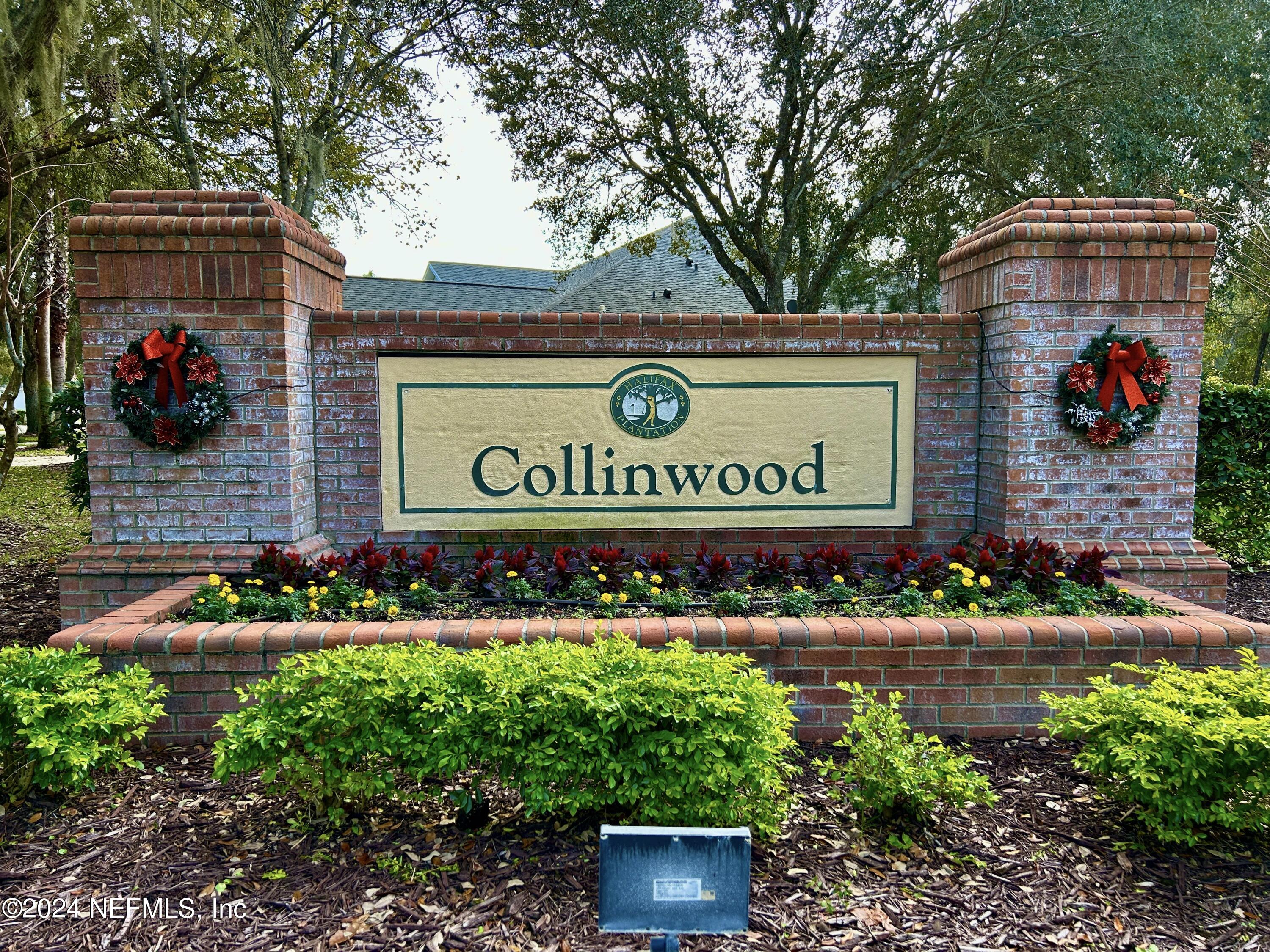 1308 Asher Court Ormond Beach, FL 32174 - Photo 32 of 40 a sign that is sitting in front of flowers