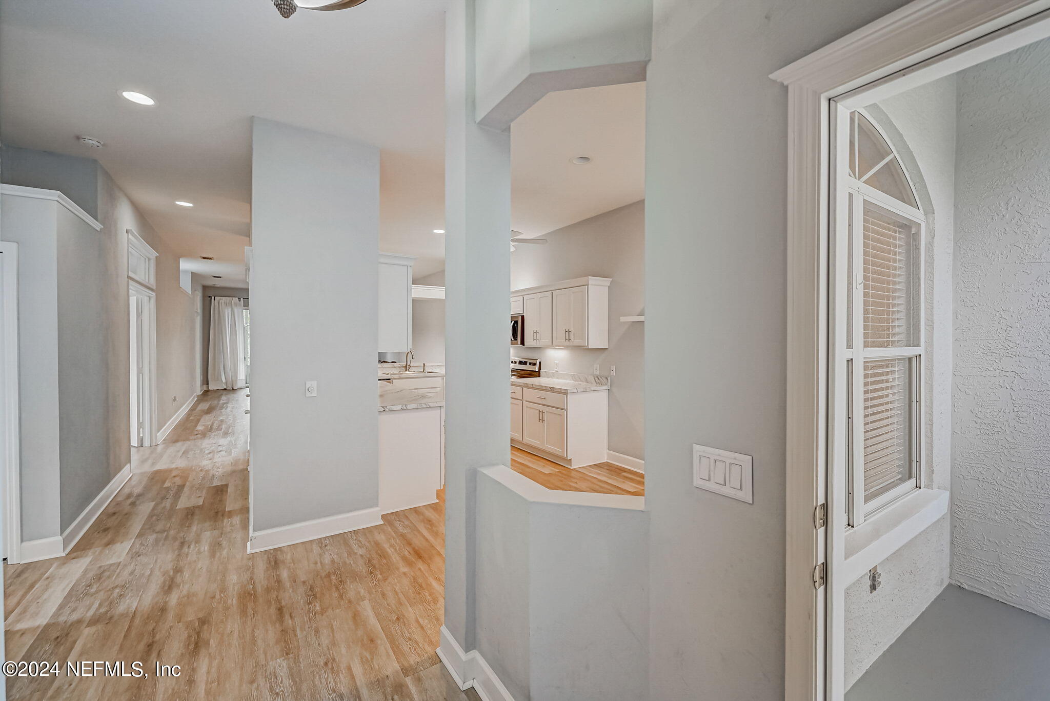 1308 Asher Court Ormond Beach, FL 32174 - Photo 6 of 40 a view of large kitchen with refrigerator and wooden floor
