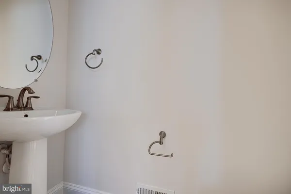 a bathroom with a sink and mirror