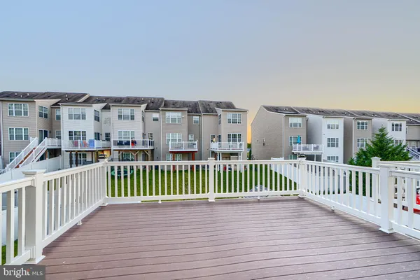 a view of a balcony with wooden deck