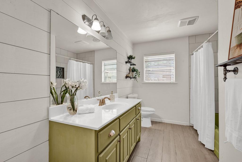 6117 Gainsborough Road Amarillo, TX 79106 - Photo 23 of 40 a bathroom with a sink a vanity and a mirror
