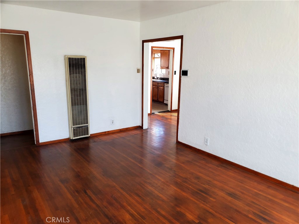 1420 South Butler Avenue Compton, CA 90221 - Photo 14 of 44 a view of an empty room with wooden floor and closet
