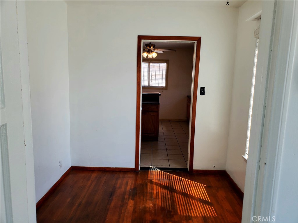 1420 South Butler Avenue Compton, CA 90221 - Photo 16 of 44 a view of a hallway with wooden floor and closet
