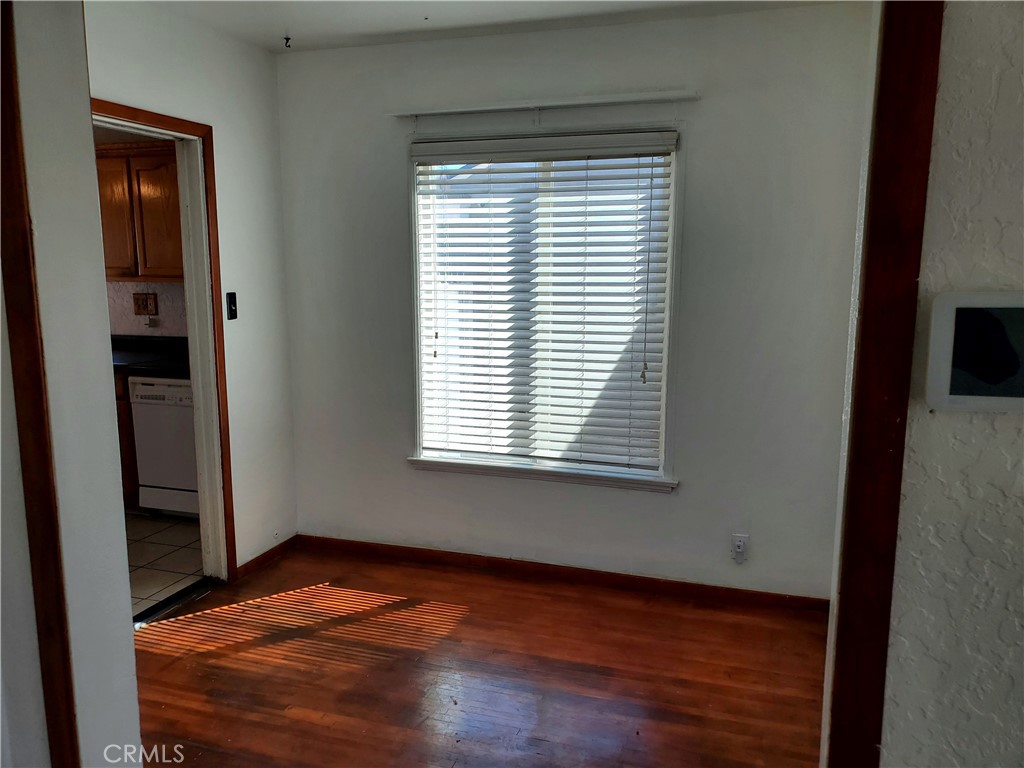 1420 South Butler Avenue Compton, CA 90221 - Photo 18 of 44 a view of empty room with wooden floor and fan