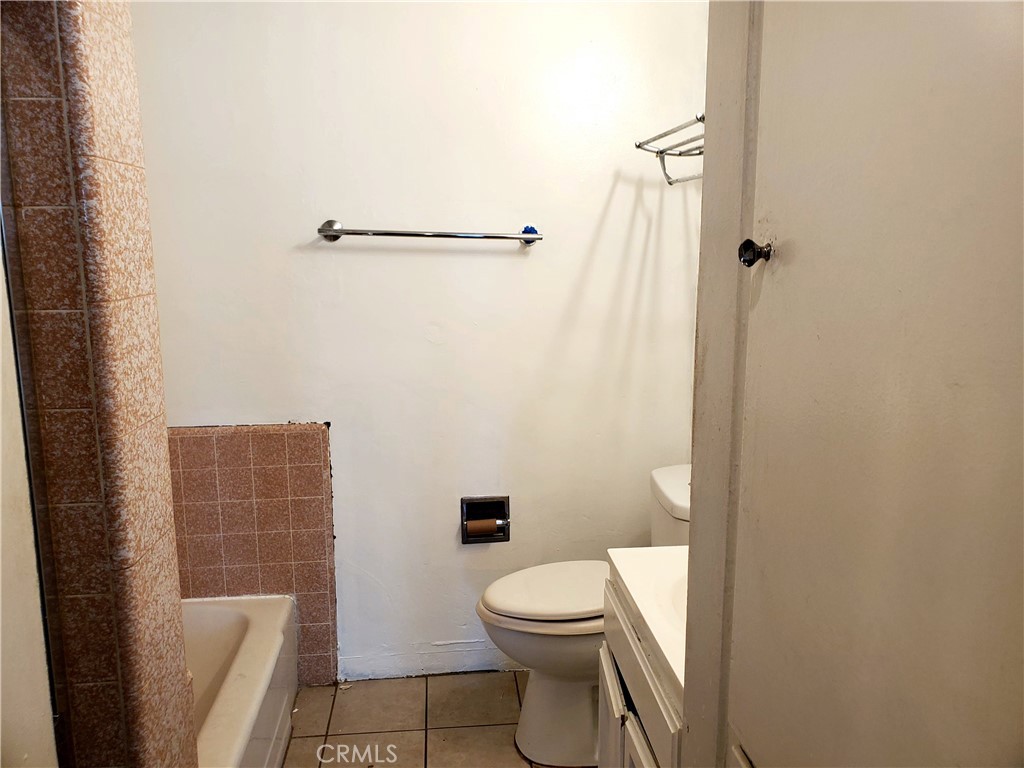 1420 South Butler Avenue Compton, CA 90221 - Photo 21 of 44 a bathroom with a toilet and a shower