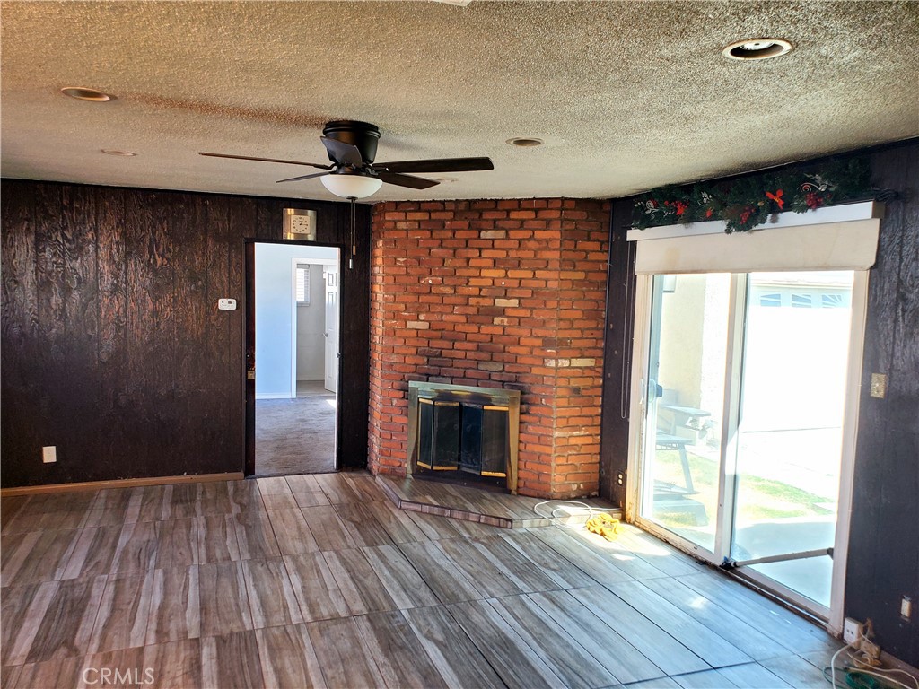 1420 South Butler Avenue Compton, CA 90221 - Photo 25 of 44 a view of empty room with wooden floor and fireplace