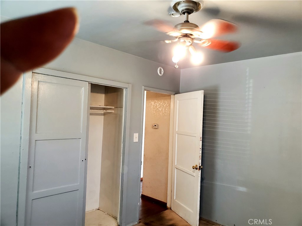 1420 South Butler Avenue Compton, CA 90221 - Photo 28 of 44 a view of a chandelier fan and closet