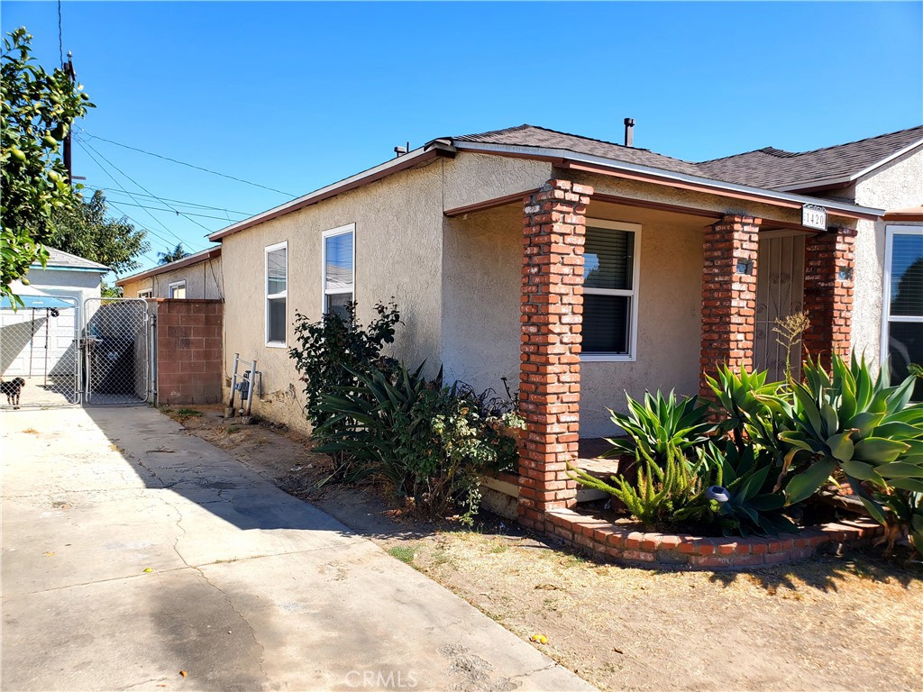 1420 South Butler Avenue Compton, CA 90221 - Photo 3 of 44 a view of a house with a yard