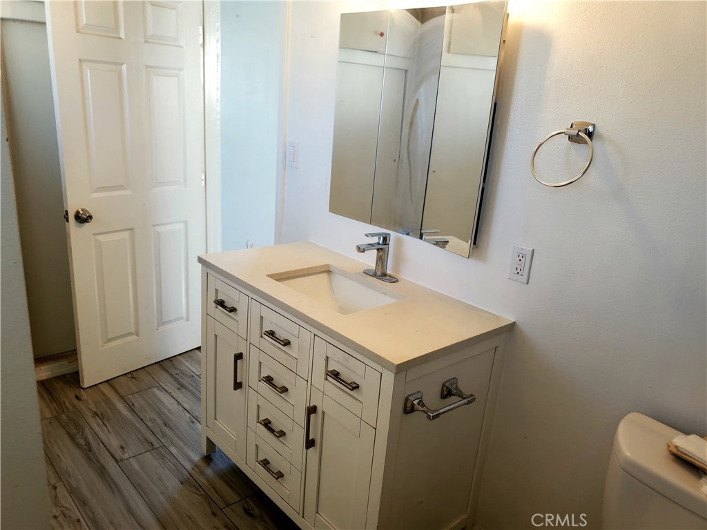 1420 South Butler Avenue Compton, CA 90221 - Photo 35 of 44 a bathroom with a sink a vanity and a mirror