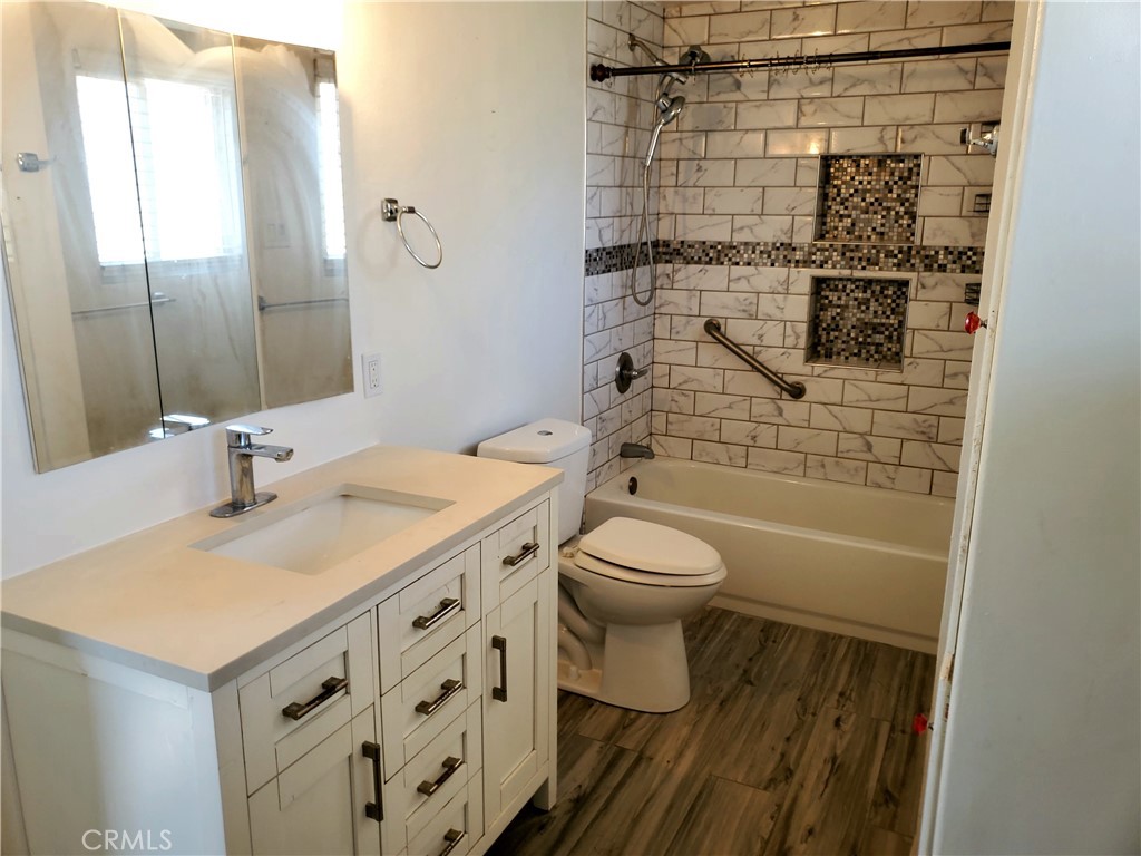 1420 South Butler Avenue Compton, CA 90221 - Photo 39 of 44 a bathroom with a sink toilet and shower