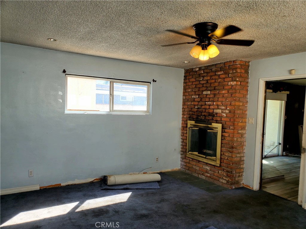 1420 South Butler Avenue Compton, CA 90221 - Photo 41 of 44 a view of a livingroom with a flesh screen tv and window