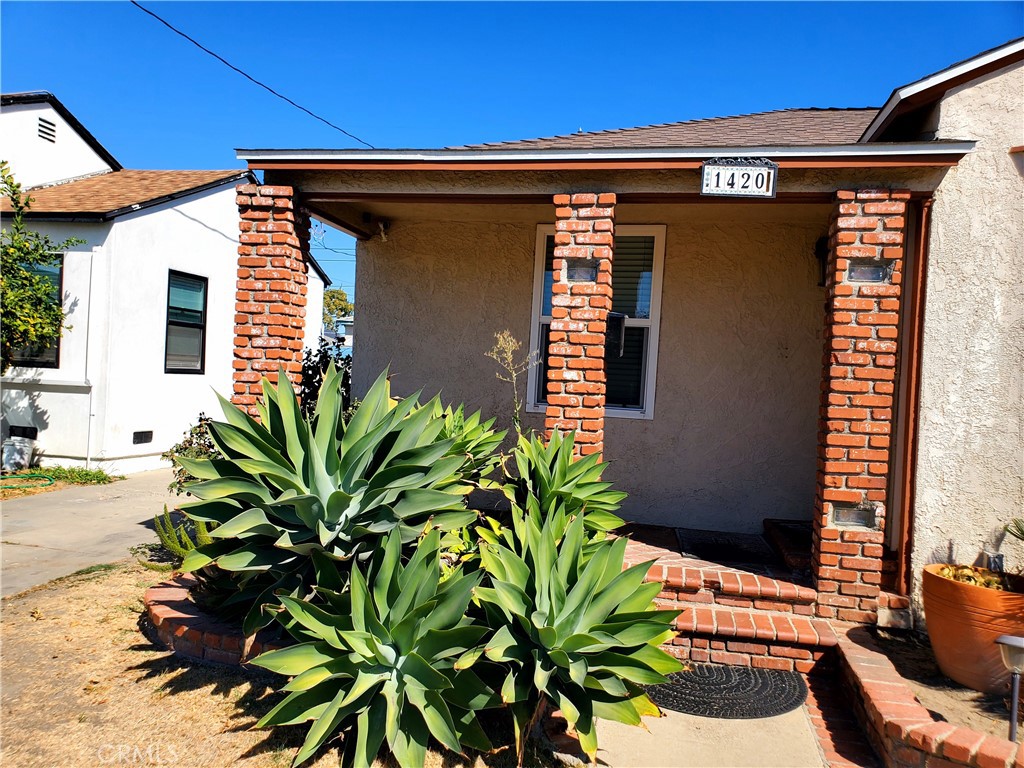 1420 South Butler Avenue Compton, CA 90221 - Photo 6 of 44 a view of front door and potted plants