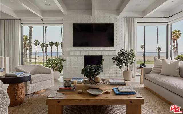 a living room with furniture fireplace and flat screen tv