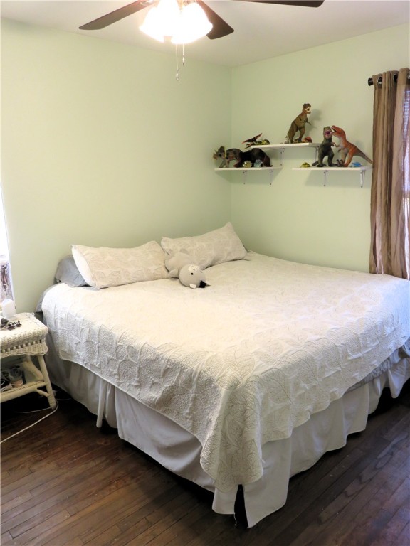 1413 Sandy Point Road Bryan, TX 77803 - Photo 11 of 23 a bedroom with a bed and a chandelier