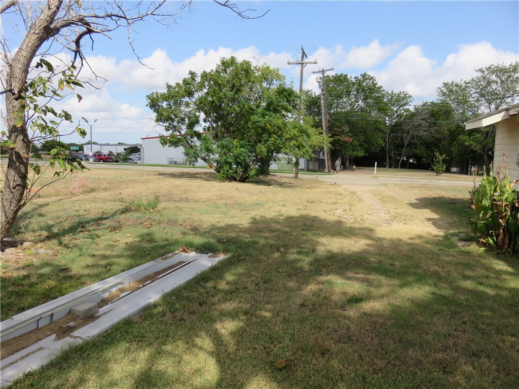 1413 Sandy Point Road Bryan, TX 77803 - Photo 19 of 23 a view of a yard with an outdoor space
