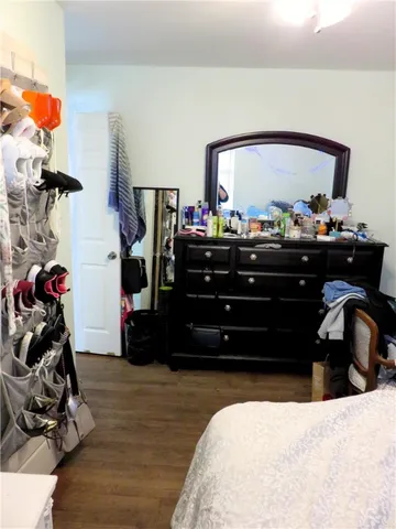 a bed room with a bed and a mirror