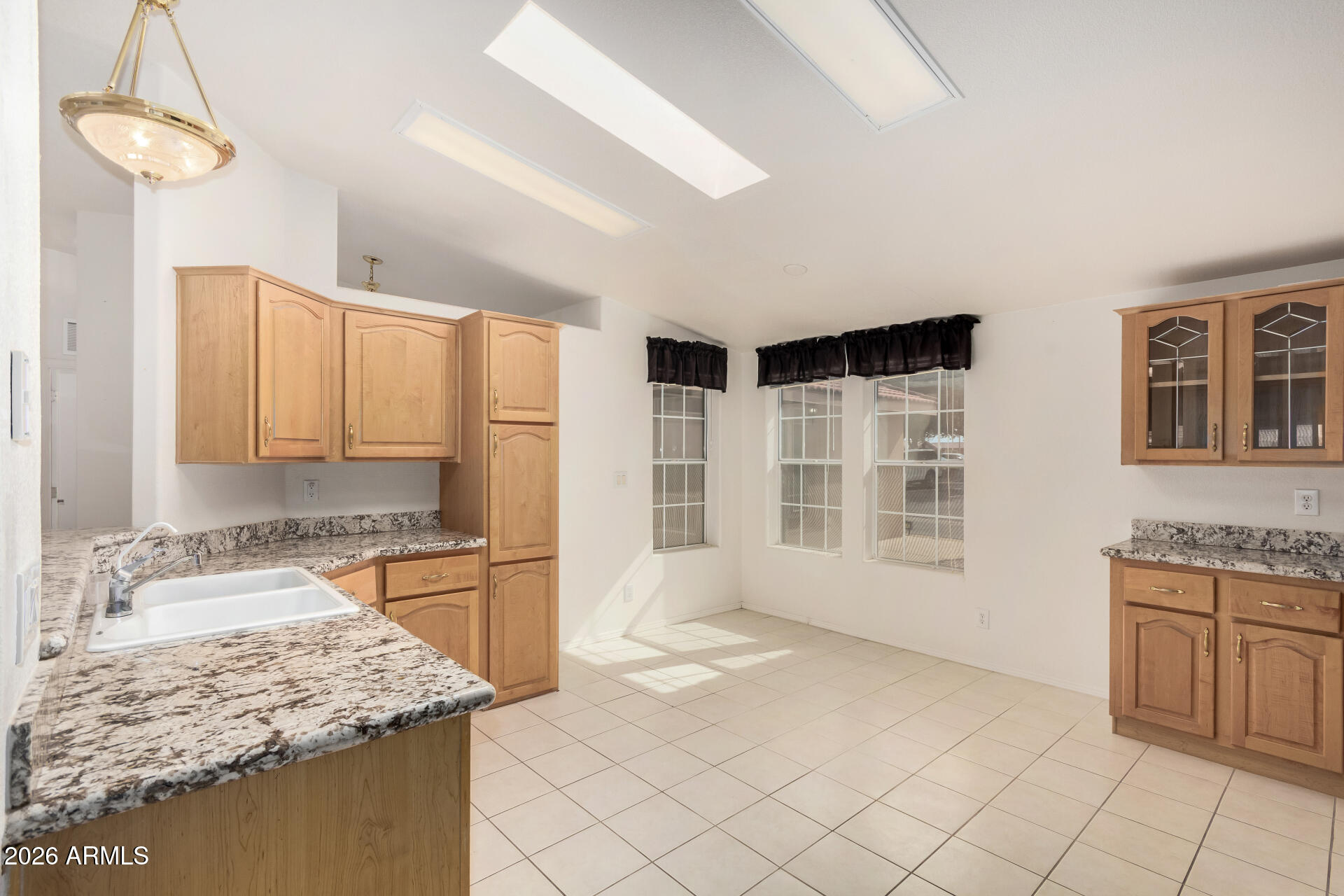 3301 South Goldfield Road, Unit 3004 Apache Junction, AZ 85119 - Photo 10 of 67 a kitchen with stainless steel appliances granite countertop a sink stove and cabinets
