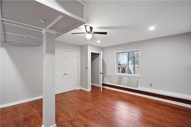 a view of livingroom with hardwood floor and ceiling fan