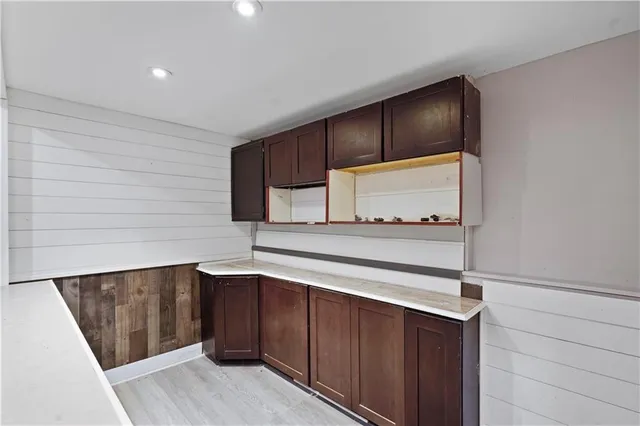 a kitchen with stainless steel appliances wooden cabinets and a sink